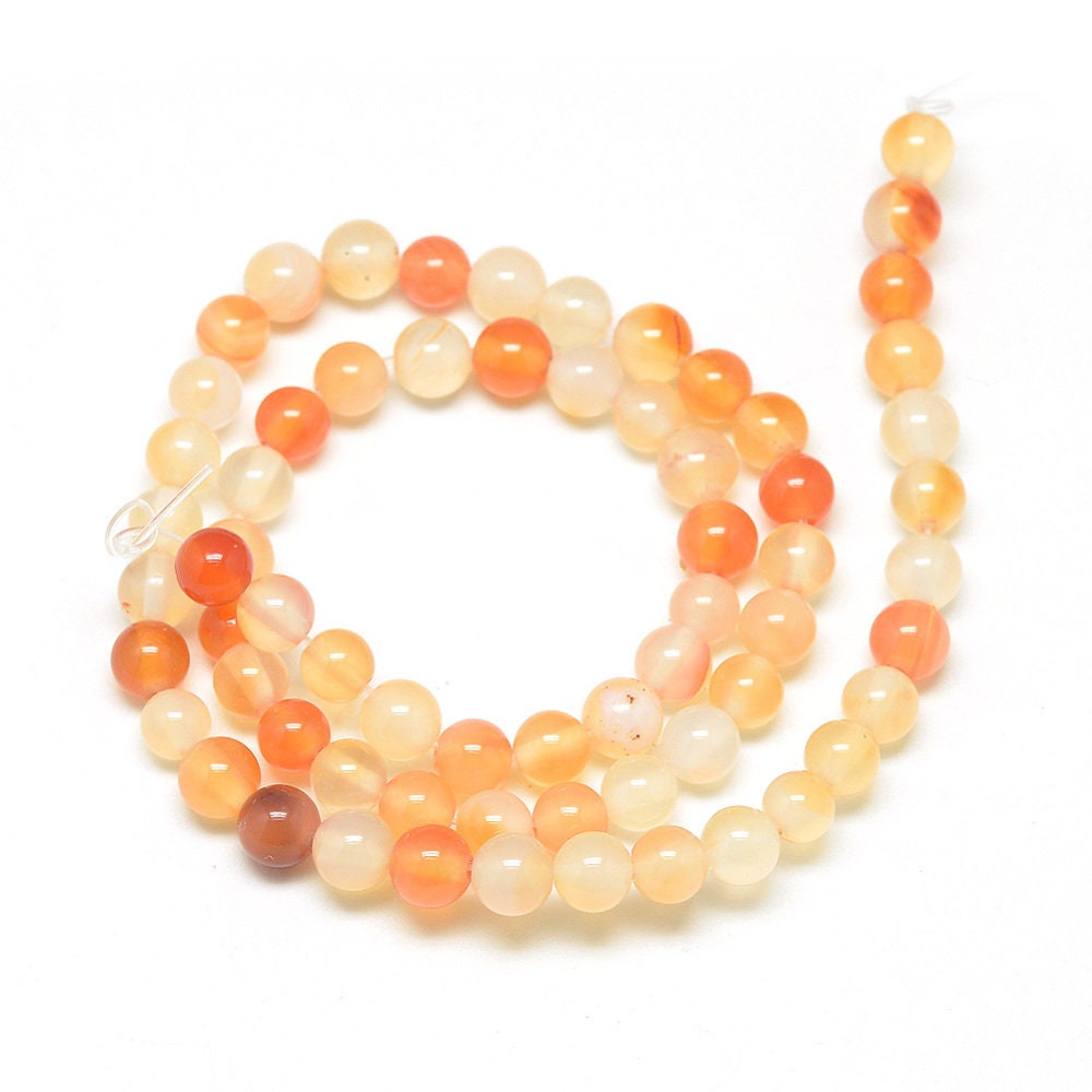 1 x strand of 6mm natural undyed orange carnelian beads, round, drilled with 1mm hole, approximately 62 beads per strand