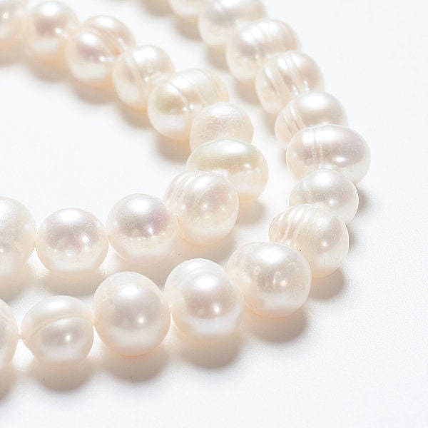 52 x grade A natural cultured freshwater pearls, potato, white, approximately 6-7mm, drilled, hole approximately 0.8mm