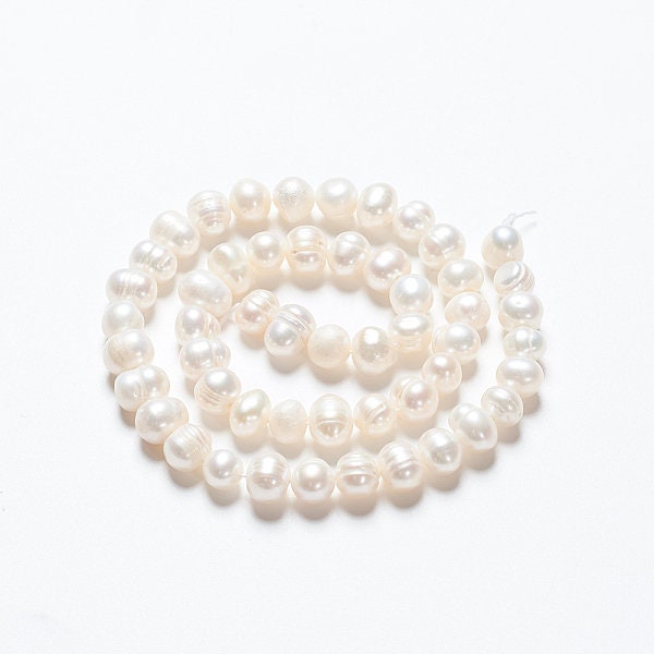 52 x grade A natural cultured freshwater pearls, potato, white, approximately 6-7mm, drilled, hole approximately 0.8mm