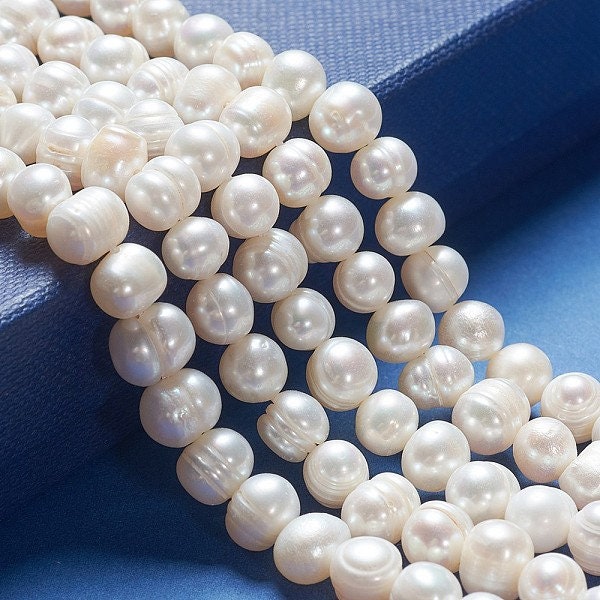52 x grade A natural cultured freshwater pearls, potato, white, approximately 6-7mm, drilled, hole approximately 0.8mm