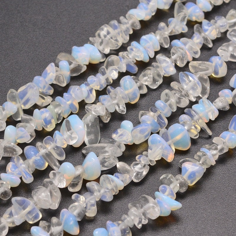 Approx 230 opalite chip beads, similar appearance to moonstone, 5~8x5~8mm, drilled with 1mm hole (approx), strand approximately 31.5 inches