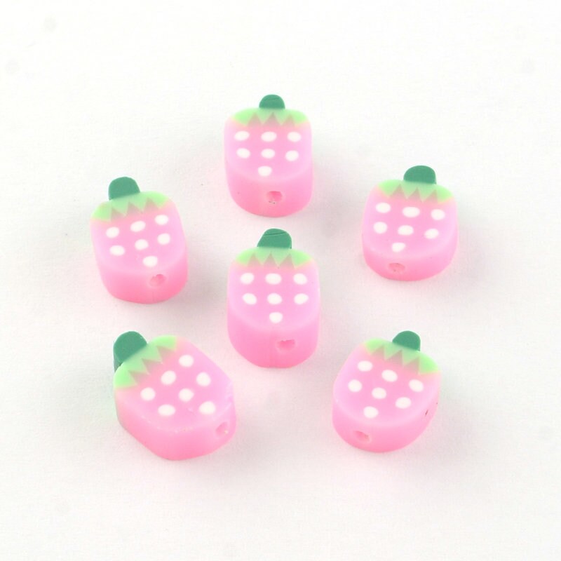 Small pink and white strawberry clay polymer beads, sized approximately 11 - 12mm x 8 - 9mm x 4 - 5 mm, hole approximately 2mm