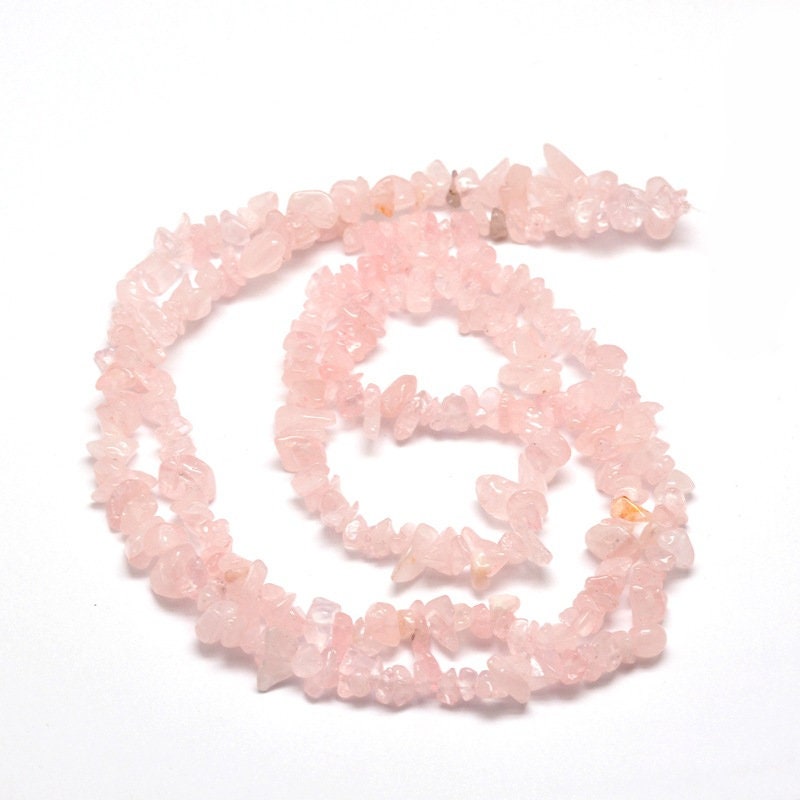 Strand 200 rose quartz chip beads, pale pink, 3-6 x 3-6mm, drilled with 1mm hole (approx), strand approximately 31.5 inches