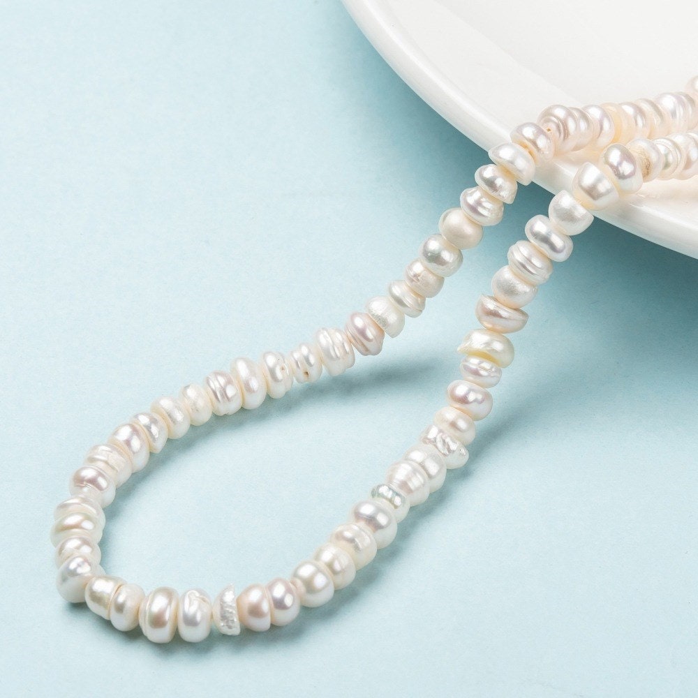 55 natural cultured grade A freshwater pearls, antique white colour, potato, approximately 7-8mm x 6-7mm, drilled, hole approx 0.8mm