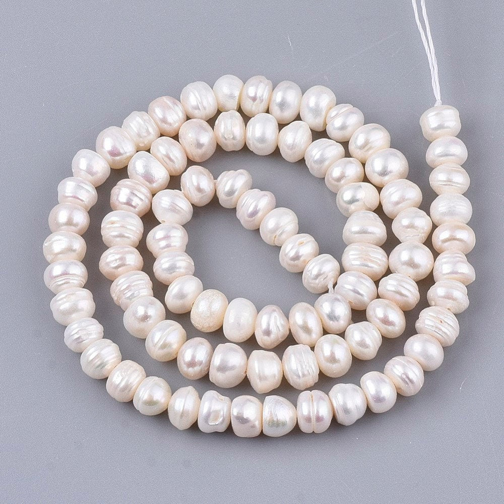 55 natural cultured grade A freshwater pearls, antique white colour, potato, approximately 7-8mm x 6-7mm, drilled, hole approx 0.8mm