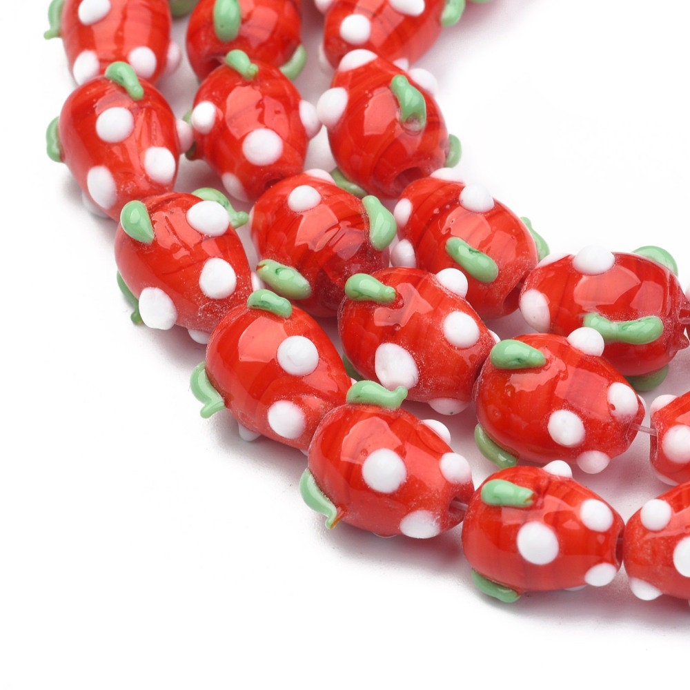 Handmade strawberry glass lampwork beads, red with white & green decoration, approximately 12.5mm x 10mm, drilled hole approx 2mm