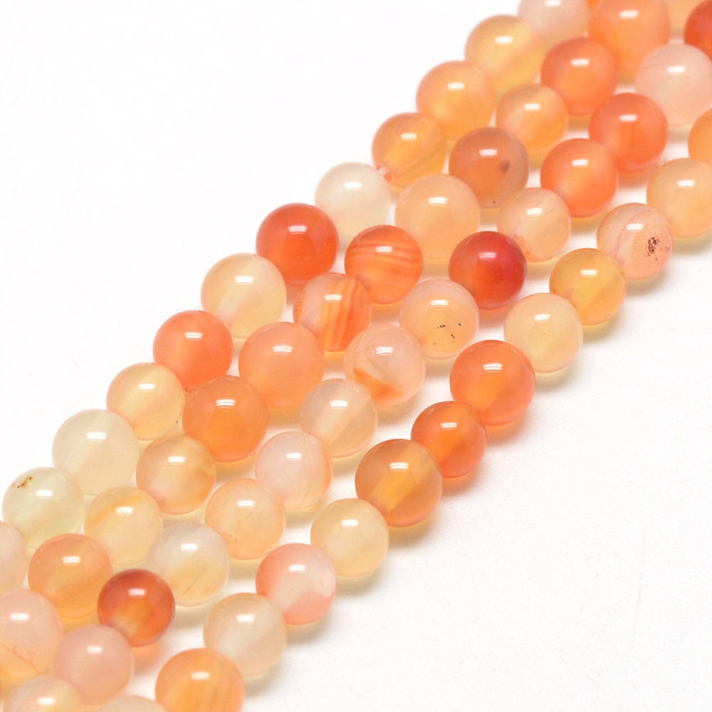 1 x strand of 6mm natural undyed orange carnelian beads, round, drilled with 1mm hole, approximately 62 beads per strand