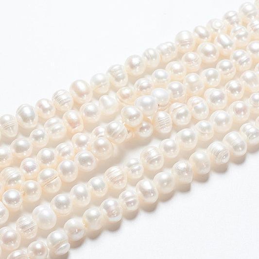 52 x grade A natural cultured freshwater pearls, potato, white, approximately 6-7mm, drilled, hole approximately 0.8mm
