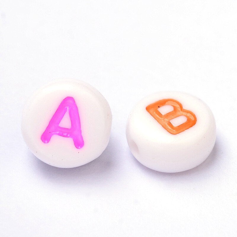 100 x small white opaque round beads, printed with various individual coloured letters, approx 7.5mm x 4 mm, drilled hole approx 1.3mm