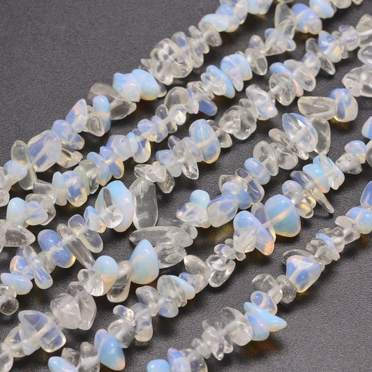 Approx 230 opalite chip beads, similar appearance to moonstone, 5~8x5~8mm, drilled with 1mm hole (approx), strand approximately 31.5 inches