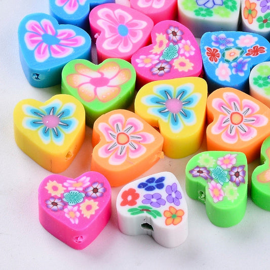 Small heart shaped clay polymer beads with floral pattern, various colours, size approx 9 - 11mm x 10 -11mm x 4 - 5mm, hole approx 2mm