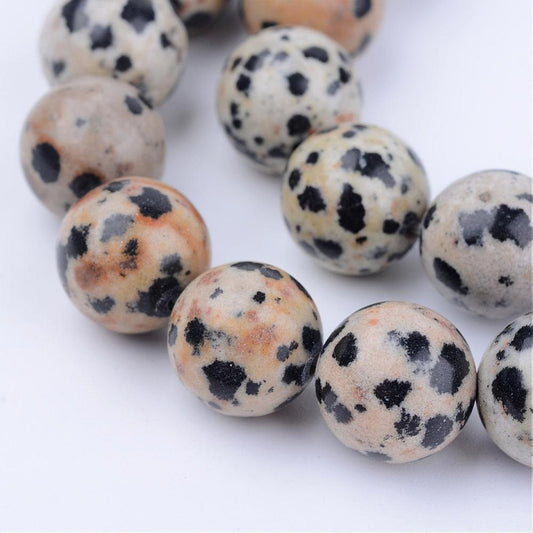 1x strand (approx. 58 beads) natural undyed dark cream and black mottled dalmation jasper beads, approx. 6mm with 1mm hole