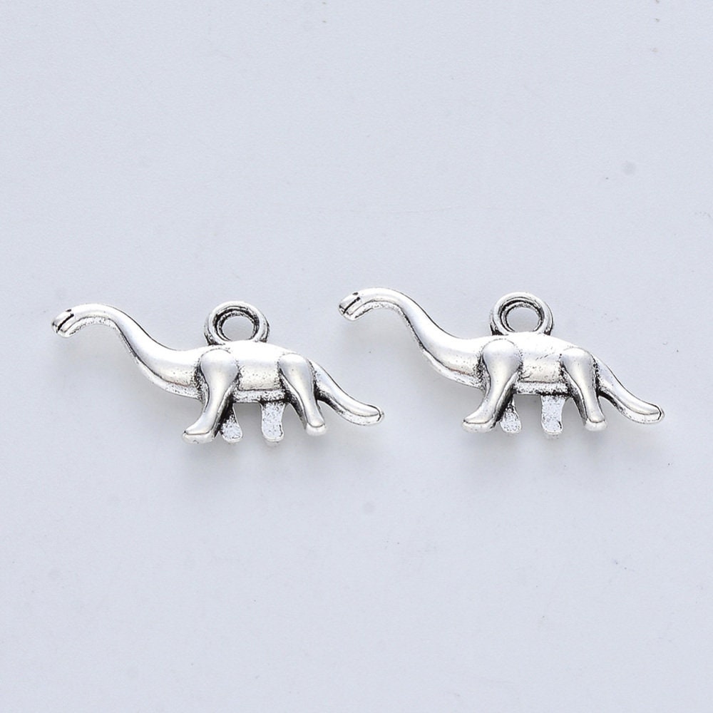 5 x dinosaur pendants, silver tone, approximately 14mm x 27mm x 3.5mm, hole approximately 2mm