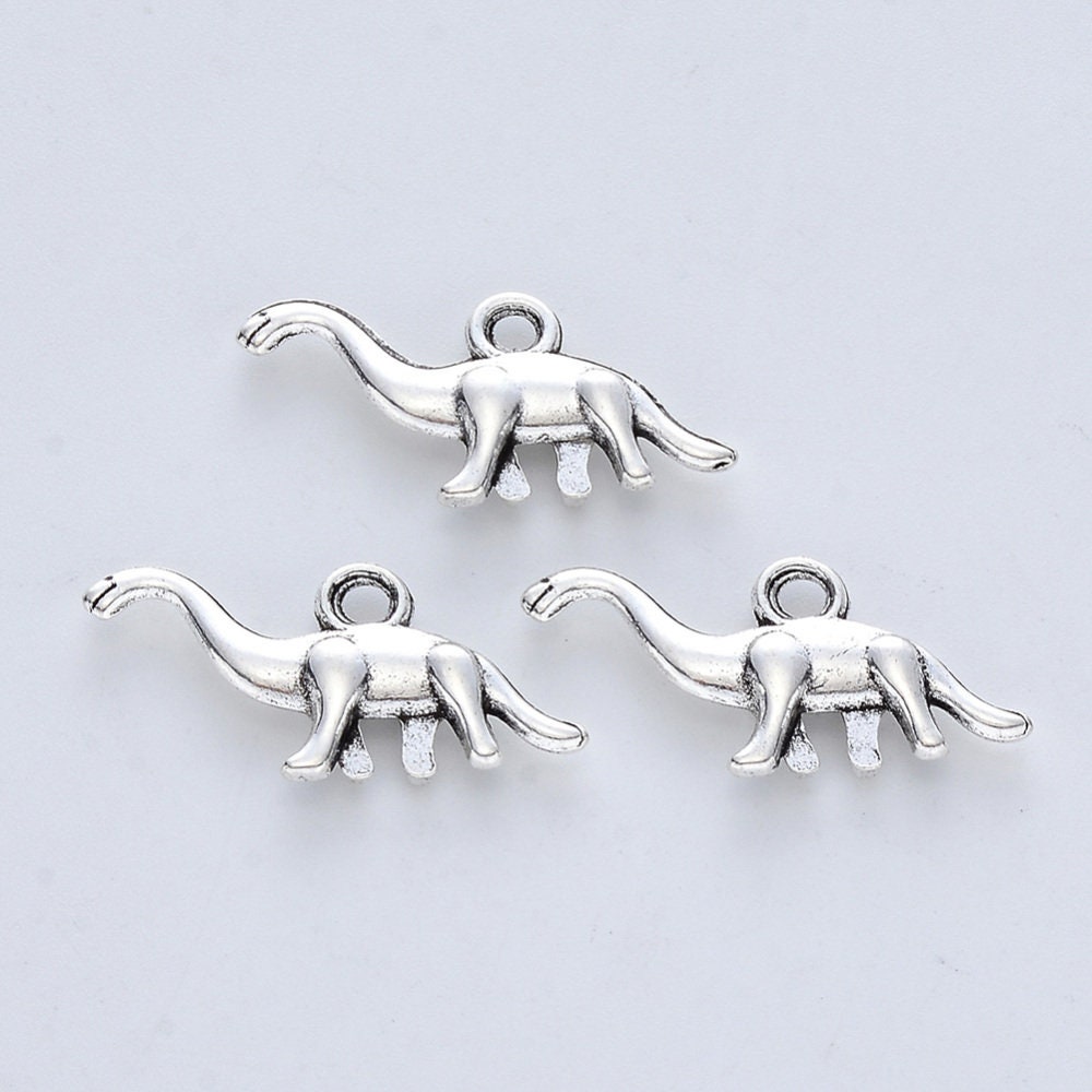 5 x dinosaur pendants, silver tone, approximately 14mm x 27mm x 3.5mm, hole approximately 2mm