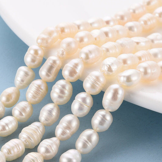 22 x natural cultured freshwater pearls, seashell colour, rice shape, approximately 7-9mm x 6-7mm, drilled, hole approximately 0.5mm